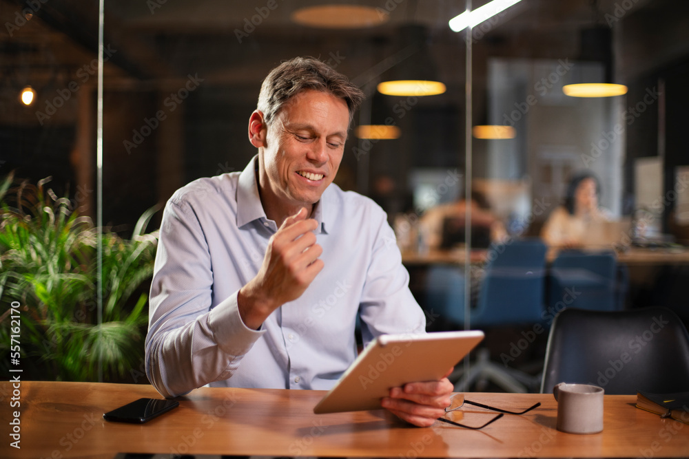 Portrait of businessman in office. Man using digital tablet. Businessman having video call. Portrait of businessman in office. Man using digital tablet. Businessman having video call.