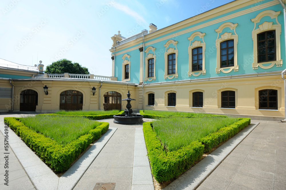 Courtyard of Mariyinsky Palace, the official ceremonial residence of President of Ukraine, fountain, grass and part of building. Kyiv, Ukraine