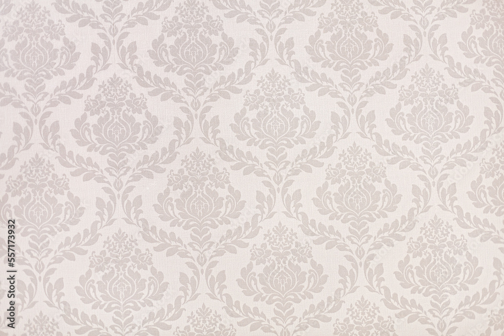 Victorian styled wallpaper texture. Beige tones and floral patterns.