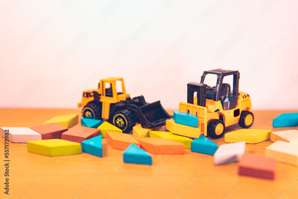 Mini forklift truck with tangram puzzle using as logic and transportation concept Mini forklift truck with tangram puzzle using as logic and transportation concept