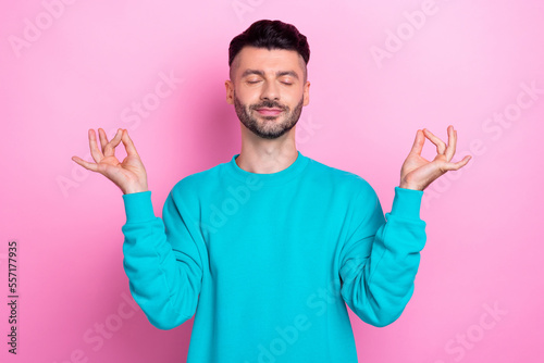 Photo of young satisfied relaxed handsome brunet hair man fingers balance asana zen after hard work days isolated on pastel pink color background