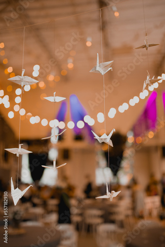 White origami birds in strings in weddings