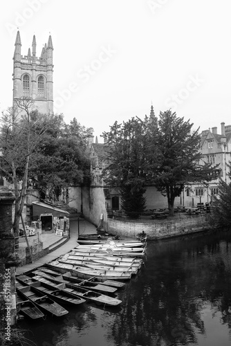 Oxford Magdalen tower and canal with wooden boats black and white