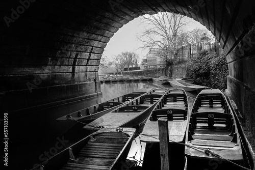 Parked boats under bridge nice stone arch - black and white