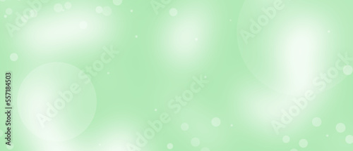 White bokeh on green background