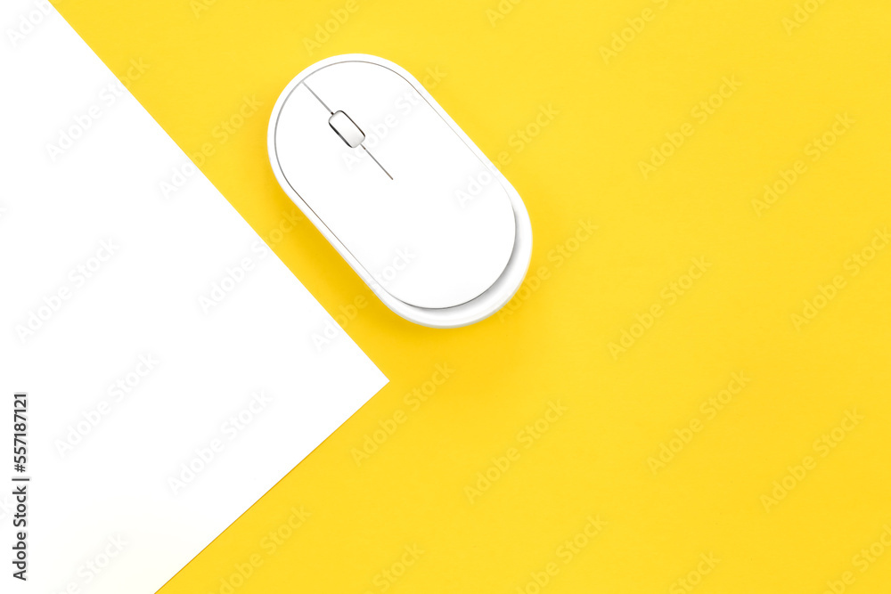 Computer mouse on a yellow background close-up, top view, conceptual minimalism. Computer mouse on a yellow background close-up, top view, conceptual minimalism.