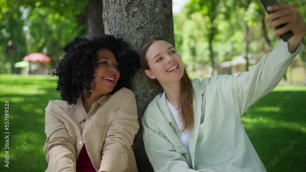 Smiling women friends taking a selfie, best friends, students hanging out Smiling women friends taking a selfie, best friends, students hanging out