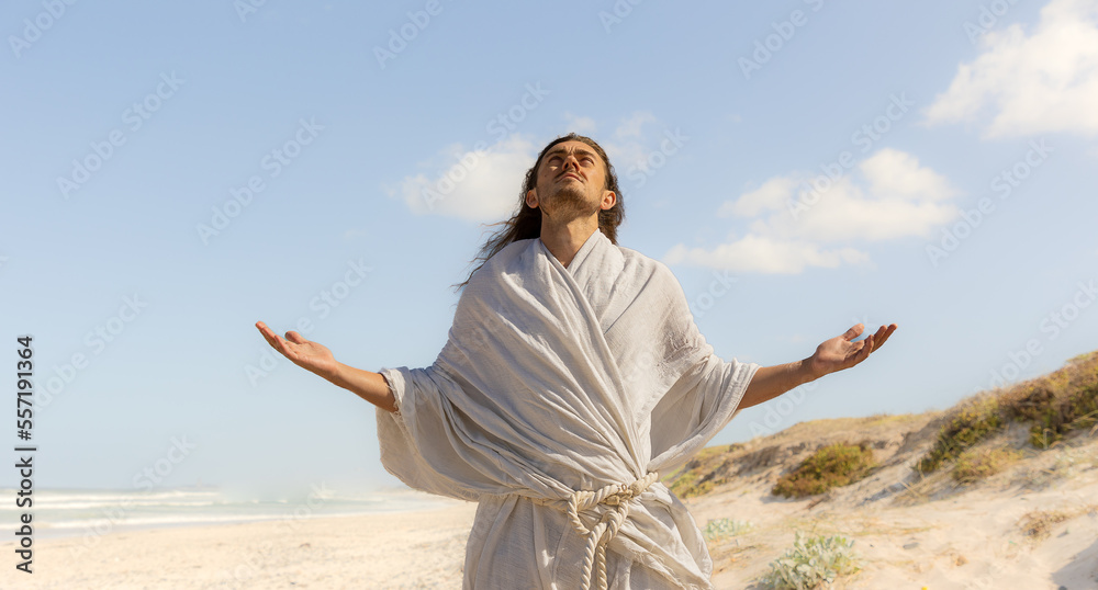 Man in white robe praising God
