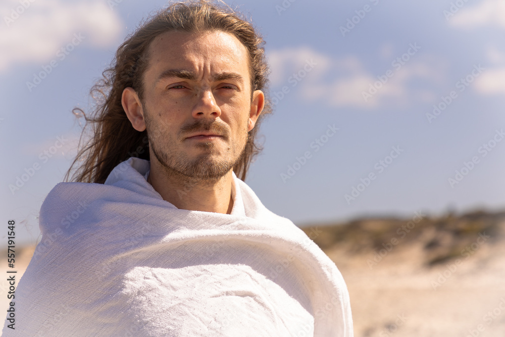 portrait of a holy man with long hair and beard looking like the Christ
