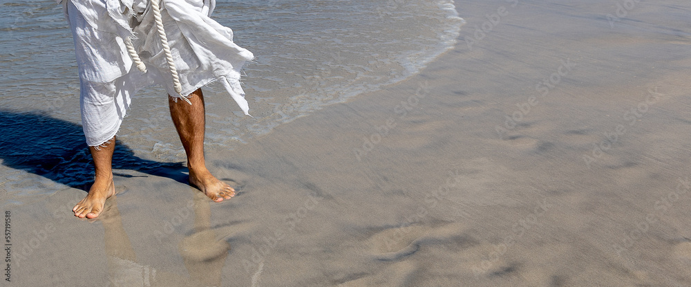 Jesus walks on water close up of legs and sea