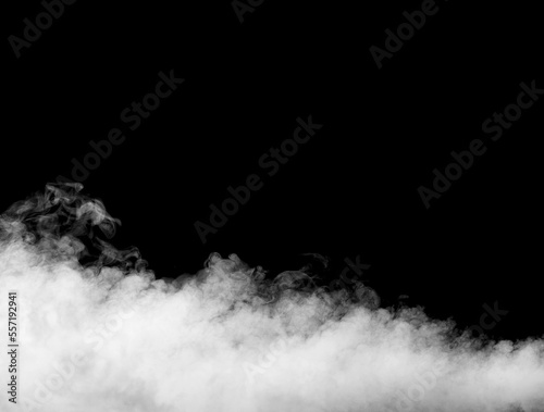 Abstract white puffs of smoke swirls overlay on black background pollution. Royalty high-quality free stock photo image of abstract smoke overlays on black background. White smoke explosion 