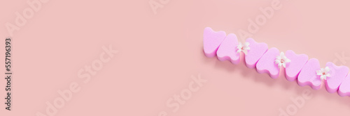 Tampons without rope on pink background. Womens hygiene. Critical days. Banner. © Evgenii