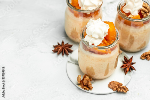 Layered pumpkin and cream cheese dessert on a light background. banner, menu, recipe place for text, top view