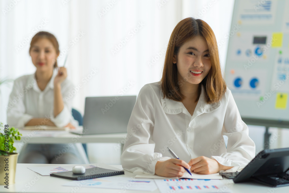 Friends of asia female employee worker discussing and accountant checking data document for investigation of corruption account. Anti Bribery concept, great business conversations Friends of asia female employee worker discussing and accountant checking data document for investigation of corruption account. Anti Bribery concept, great business conversations