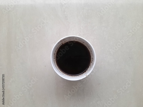 black coffee drink in glass top view on wooden table