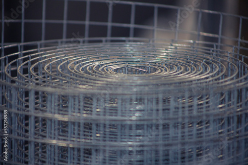 Metal mesh close-up, metal background slightly blurred. Metal grid for welding. Metal construction for ventilation