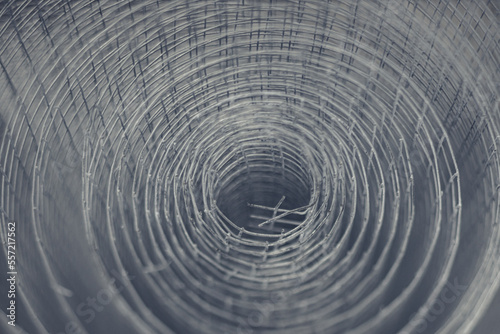 Metal mesh close-up, metal background slightly blurred. Metal grid for welding. Metal construction for ventilation