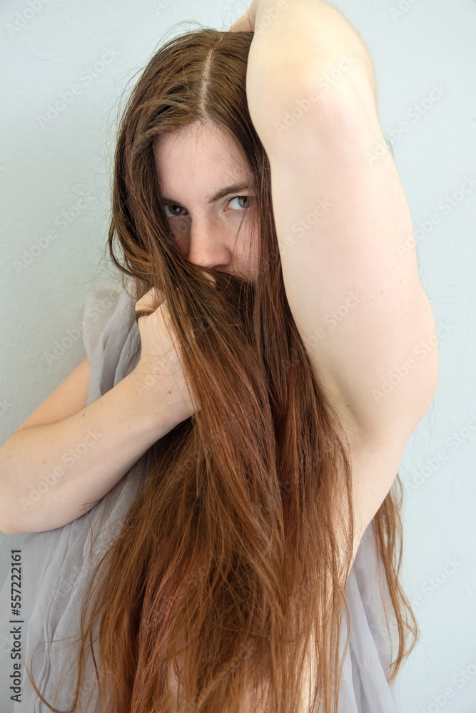 sensual, brunette long haired fashion beauty model woman, wrapping herself in a scarf and her long hair sensual, brunette long haired fashion beauty model woman, wrapping herself in a scarf and her long hair