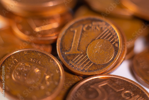 A pile of change on the table. Many euro coins in one stack. The concept of a monetary crisis in the country. Selective soft focus