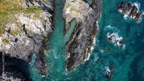 Turquoise waters of the Atlantic Ocean and large coastal cliffs. Beautiful seascape, top view. Drone point of view.