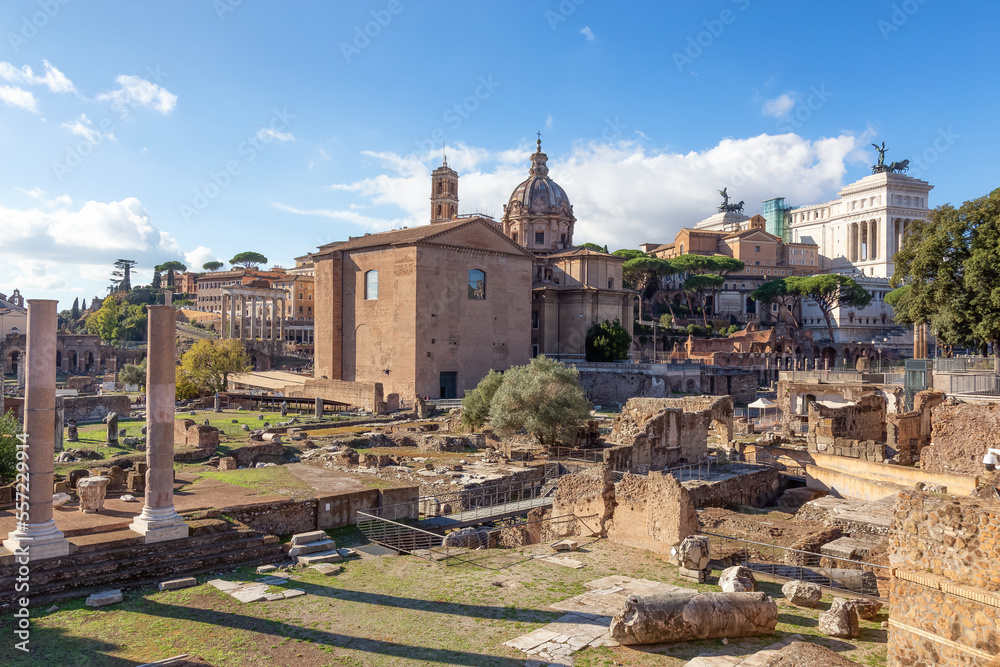 Ancient Remains in Rome, Italy. Roman Forum. Sunny Cloudy Sky.