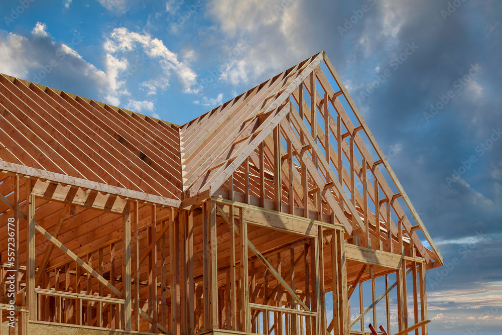 During construction of new stick home wooden roof beam was constructed from an adjacent framework frame made from trusses. During construction of new stick home wooden roof beam was constructed from an adjacent framework frame made from trusses.