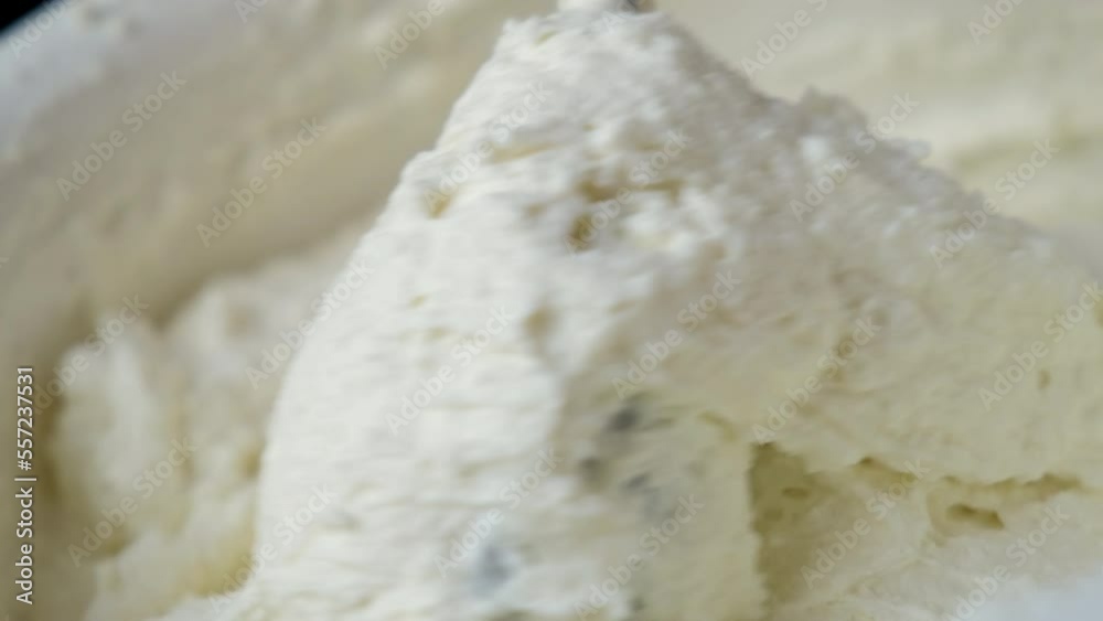 the process of cooking tiramisu. chef cooks homemade mascarpone. whipped cream is mixed with cottage cheese the process of cooking tiramisu. chef cooks homemade mascarpone. whipped cream is mixed with cottage cheese
