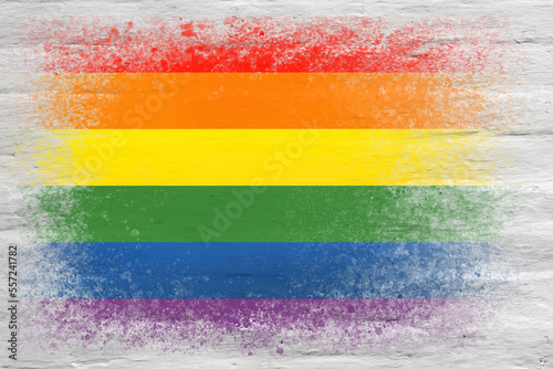 Flag of LGBT. Flag painted on a white plastered brick wall. Brick background. Copy space. Textured background