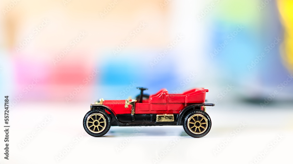 Red classic car toy, shallow depth of field. Red classic car toy, shallow depth of field.
