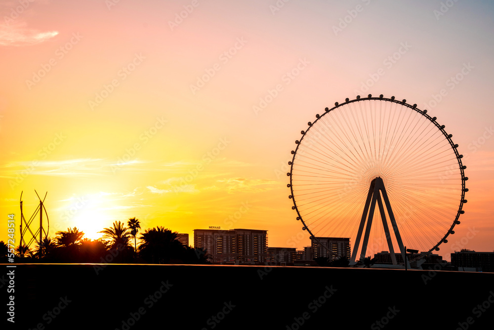 Dubai, United Arab Emirates – February 13, 2021: Beautiful evening landscape with Dubai eye on the Jumeirah beach at sunset.