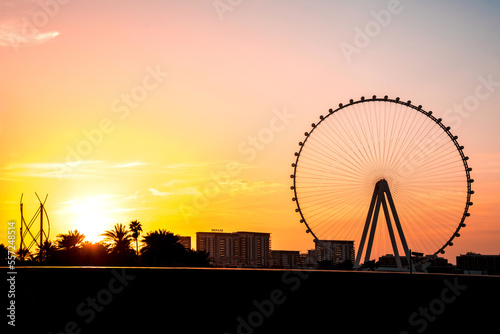 Obraz na płótnie Dubai, United Arab Emirates – February 13, 2021: Beautiful evening landscape with Dubai eye on the Jumeirah beach at sunset. w salonie
