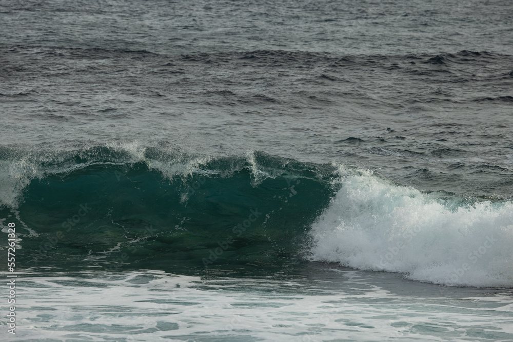 A big wave that's about to collapse. A huge power what this water has. A big wave that's about to collapse. A huge power what this water has.