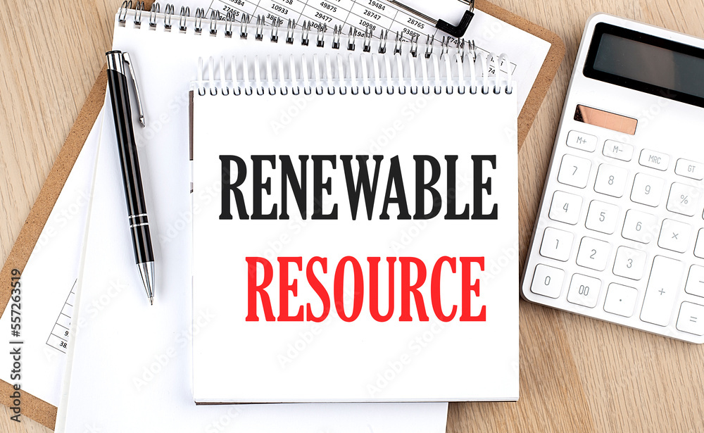 RENEWABLE RESOURCE is written in white notepad near a calculator, clipboard and pen. Business concept RENEWABLE RESOURCE is written in white notepad near a calculator, clipboard and pen. Business concept