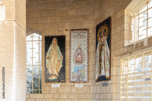 Nazareth, Israel, February 12, 2022 : Icons depicting the Virgin Mary and the baby in her arms hang on the walls in the courtyard of the Church Of Annunciation in Nazareth, northern Israel photo