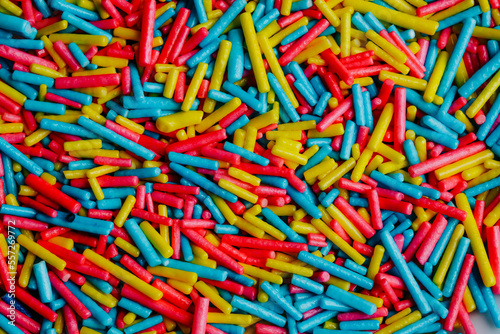 Macro photography of long colored candies. Candy concept.