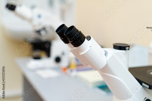 Biotechnology professional researching. Modern laboratory microscope technologies.