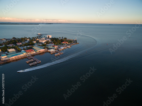 Caribbean Sea and Belize Cityscape with Lighthouse. Boat on Water
