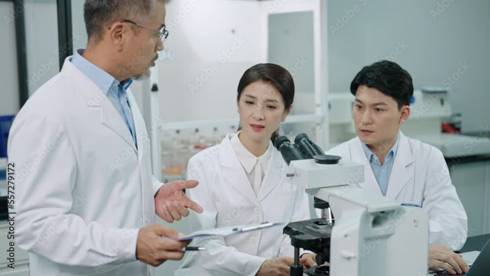 Chinese researchers discussing in laboratory,4K Chinese researchers discussing in laboratory,4K