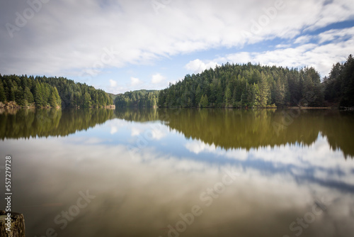 Beautiful landscape with reflection in the forest lake calm water
