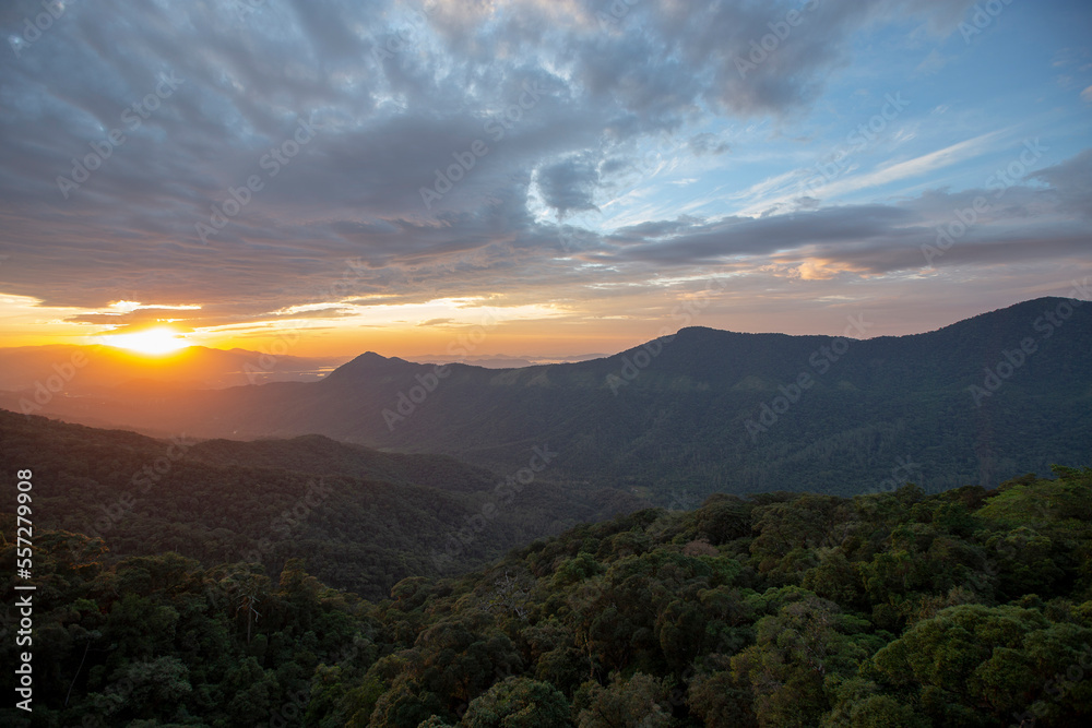 Sun rising over the clouds, in the hills. Immigrants highway, Santos, Sao Paulo state, Brazil Sun rising over the clouds, in the hills. Immigrants highway, Santos, Sao Paulo state, Brazil