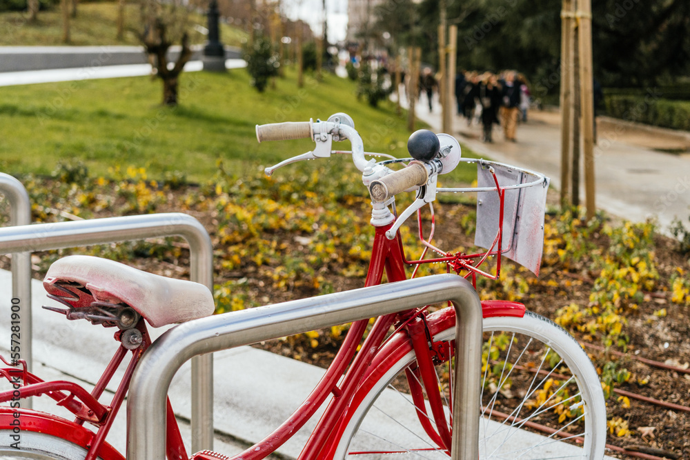 Vintage red bicycle parked in the park