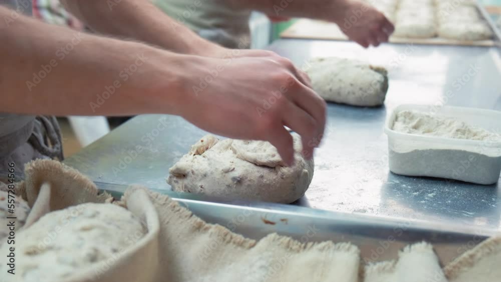baker at work. The baker shapes the bread. Hands on the close-up foruyut bread baker at work. The baker shapes the bread. Hands on the close-up foruyut bread