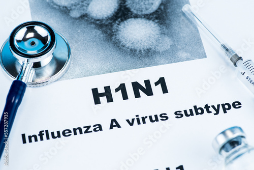 Close up of Influenza A virus subtype H1N1 word disease and stethoscope,Medical health concept photo