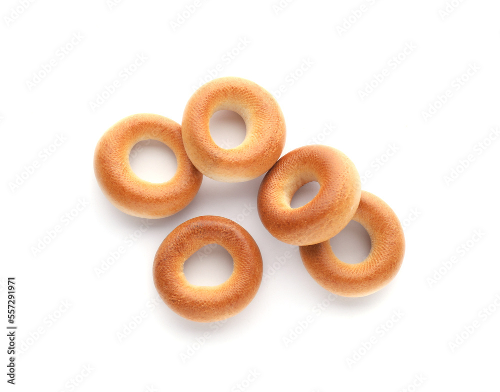Many tasty dry bagels (sushki) isolated on white, top view Many tasty dry bagels (sushki) isolated on white, top view