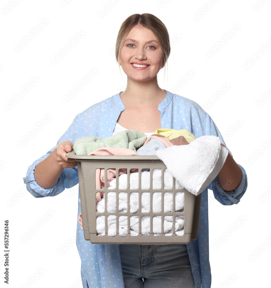 Happy woman with basket full of laundry on white background