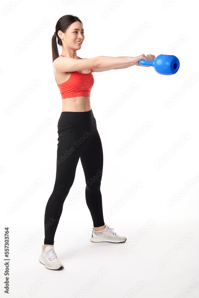 Athletic woman exercising with kettle bell, on white background, Beautiful young asian sport woman with sportswear ready for exercise Athletic woman exercising with kettle bell, on white background, Beautiful young asian sport woman with sportswear ready for exercise