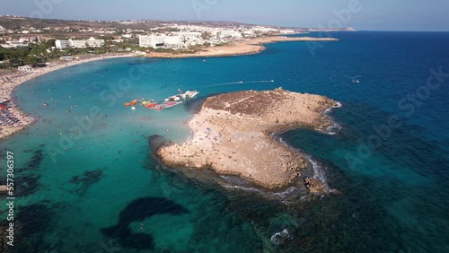 Scenic areal shot of the nissi beach island in Ayia Napa Cyprus on a clear sunny day with croded beach and crystal clear blue waters. photo