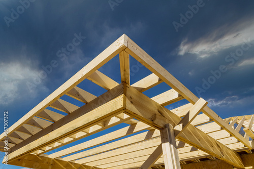 During construction of new stick home wooden roof beam was constructed from an adjacent framework frame made from trusses.
