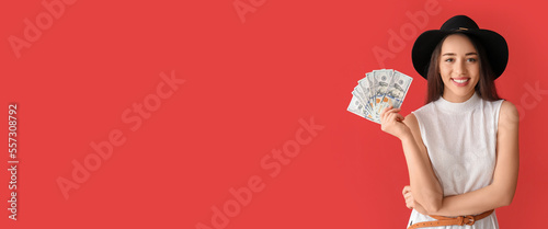 Happy young woman holding d...