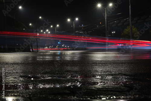 Wet road and glowing lights...